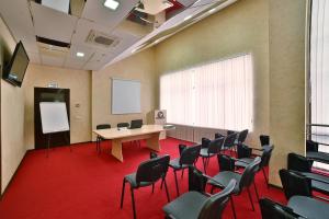 a conference room with a table and chairs in it at HELIOPARK Cruise in Penza