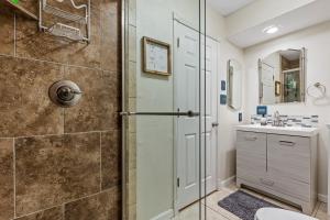 a bathroom with a shower and a toilet and a sink at The Golfview Getaway in Flagstaff +20 photos