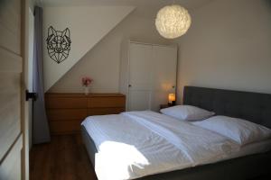 Postel nebo postele na pokoji v ubytování Apartmán pod Plešivcem