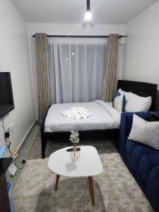 Ένα ή περισσότερα κρεβάτια σε δωμάτιο στο Comfort Haven Tsavo +8 φωτογραφίες