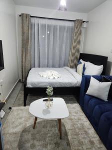 Ένα ή περισσότερα κρεβάτια σε δωμάτιο στο Comfort Haven Tsavo