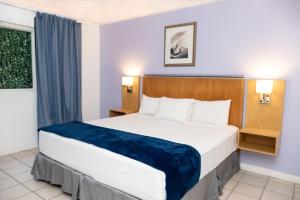 Rúm í herbergi á Deja Resort All Inclusive