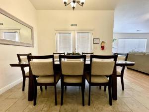 a dining room with a table and chairs at Newly Remodeled Home Near Zion - Patio & Grill in La Verkin