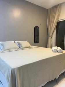Ένα ή περισσότερα κρεβάτια σε δωμάτιο στο Villa brisa icaraizinho Quarto 6 andar superior