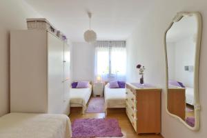 Posteľ alebo postele v izbe v ubytovaní Cozy beach apartment Split