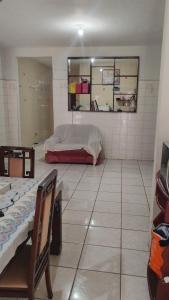 a bedroom with a bed and a tiled floor at Mário in Una
