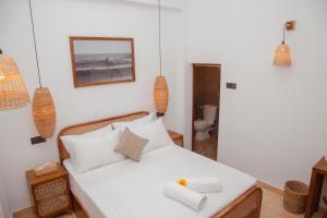 Postel nebo postele na pokoji v ubytování LUMA Ahangama Villa + 5 fotografií