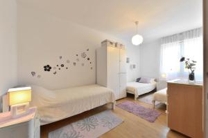 Posteľ alebo postele v izbe v ubytovaní Cozy beach apartment Split