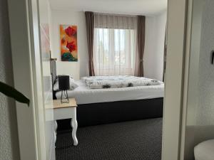 Postel nebo postele na pokoji v ubytování Ferienwohnung Rheinfelden (Beuggen)