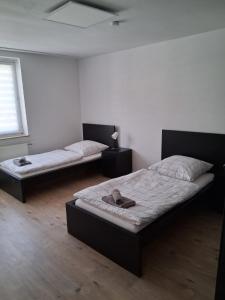 Ένα ή περισσότερα κρεβάτια σε δωμάτιο στο Haus Blankenagel 2