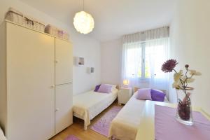 Posteľ alebo postele v izbe v ubytovaní Cozy beach apartment Split