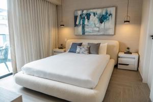 Postel nebo postele na pokoji v ubytování Aston Rubi City Suites