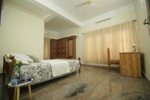 Katil atau katil-katil dalam bilik di Prakriti Homestay
