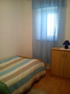 Łóżko lub łóżka w pokoju w obiekcie Apartment Toncic