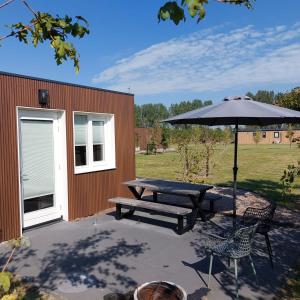 Zahrada ubytování De Fazant - Tiny House in de Zeeuwse Natuur + 34 fotografií