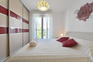 Posteľ alebo postele v izbe v ubytovaní Cozy beach apartment Split