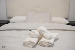 Postel nebo postele na pokoji v ubytování Casa de Huéspedes Gomez Ulla 2