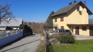 a car parked in front of a house at Apartman 4M in Ogulin
