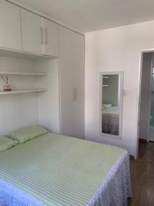 a bedroom with a bed and a mirror at Amenity at the Best of Aracaju 2 Beds in Aracaju
