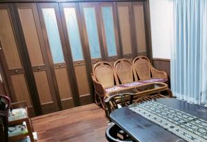 a room with three chairs and a table in a room at Kanupata - Vacation STAY 18613 in Ishigaki Island +1 photo