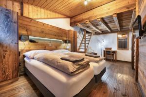 Postel nebo postele na pokoji v ubytování Hôtel Le Grand Chalet