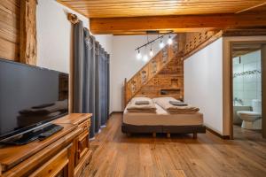 Postel nebo postele na pokoji v ubytování Hôtel Le Grand Chalet