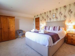 Postel nebo postele na pokoji v ubytování Ty Cerrig