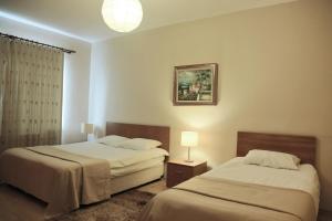Postel nebo postele na pokoji v ubytování Airport Residence + 37 fotografií