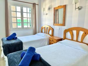 Una cama o camas en una habitación de Casa Sun 24 fotos más