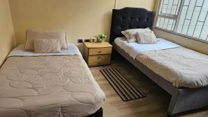 Postel nebo postele na pokoji v ubytování Colisseum Roma House - Turin- Campin Movistar Embajada cubo colsubsidio