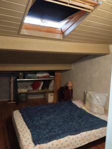 a bedroom with a bed and a skylight at Maison 2 faces Argeles Centre Ville in Argelès-sur-Mer