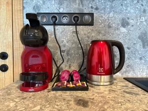 a coffeemaker and a coffee maker on a counter at Modern Alpine Apartment Corso Harrachov in Harrachov