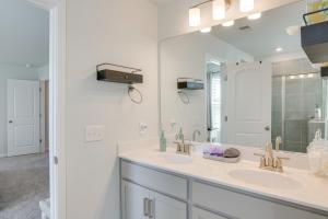 a bathroom with two sinks and a large mirror at Work, Explore and More Lebanon Family Home! in Lebanon +22 photos