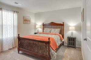 a bedroom with a bed with an orange bedspread at Work, Explore and More Lebanon Family Home! in Lebanon