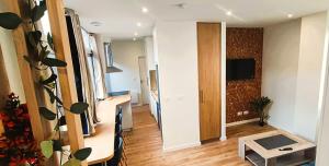 Televízia a/alebo spoločenská miestnosť v ubytovaní Appartements - Halles Brauhauban Tarbes