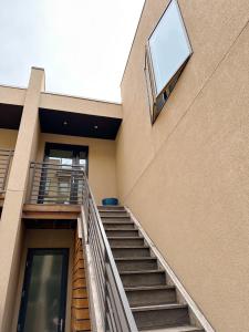 a building with stairs and a window on the side at 1 bed apartment with parking - Denver Museum District Walk to Convention Center, Capital, museums and shops in Denver