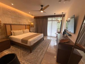 Voodi või voodid majutusasutuse Hotel Mundo Maya Chichén Itzá toas