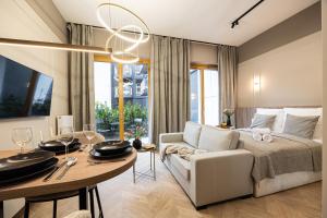 TV a/nebo společenská místnost v ubytování 2HomeRent Apartamenty Nowy Port