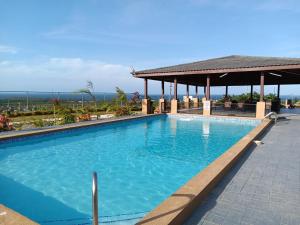 The swimming pool at or close to A serene getaway by the oasis