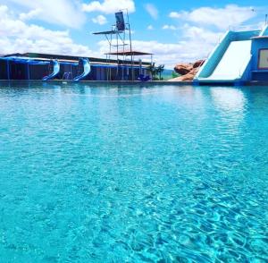 a water slide in the middle of a body of water at Ecovila Sertão in Petrolândia