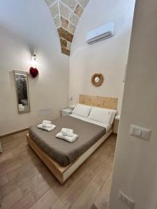 Postel nebo postele na pokoji v ubytování Castrum Rooms