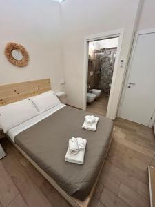 Postel nebo postele na pokoji v ubytování Castrum Rooms