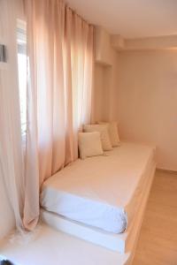 Posteľ alebo postele v izbe v ubytovaní StayBridge Apartments, Mesongi