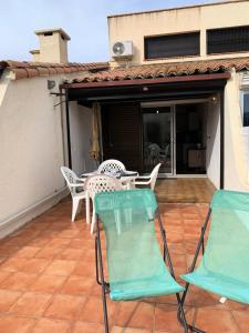 Balkón alebo terasa v ubytovaní Résidence Héliovillage - VILLA 4 pers. CAP D'AGDE MAE-2944