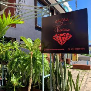 a sign for a hotel with a red diamond on it at pousada vista in Salvador