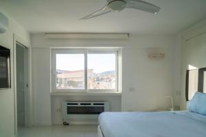 Ένα ή περισσότερα κρεβάτια σε δωμάτιο στο Caravaggio Luxury Apartment