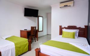 Rúm í herbergi á Hotel el imperio