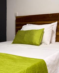 Rúm í herbergi á Hotel el imperio