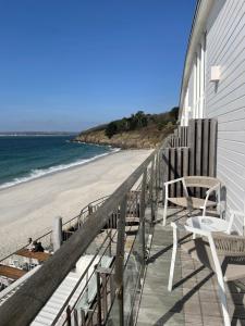 a balcony of a house with a view of the beach at Les Sables Blancs in Concarneau +137 photos