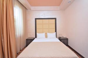 Postel nebo postele na pokoji v ubytování Partez Boutique Hotel
